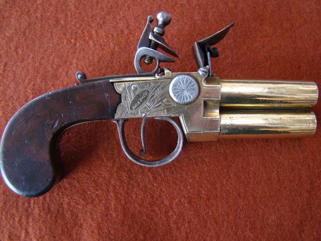 A fine British flintlock Naval Officer's over and under barreled flintlock pistol circa 1800-1810